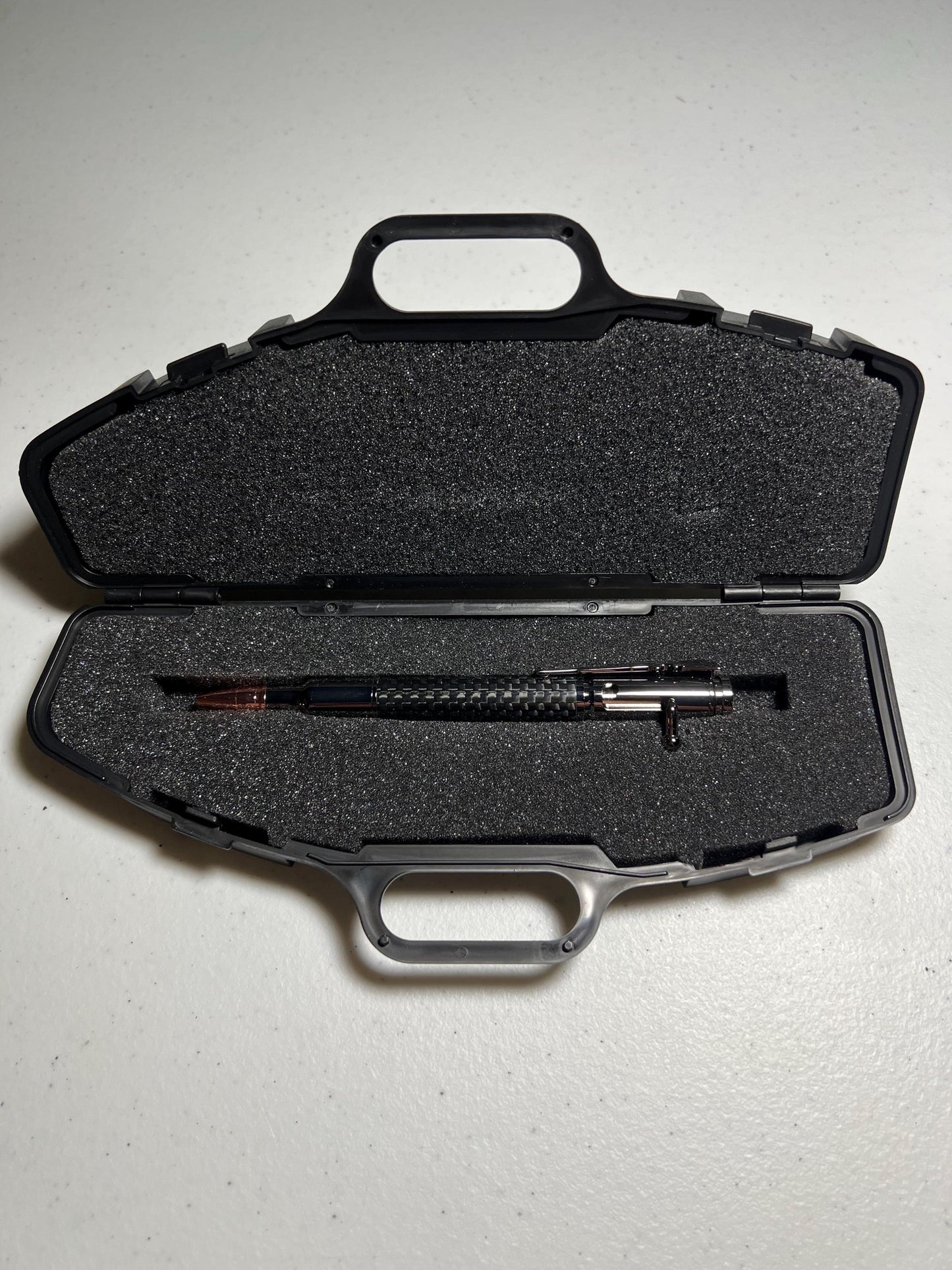 Bolt-action rifle pen gunmetal fittings with carbon fiber barrel.