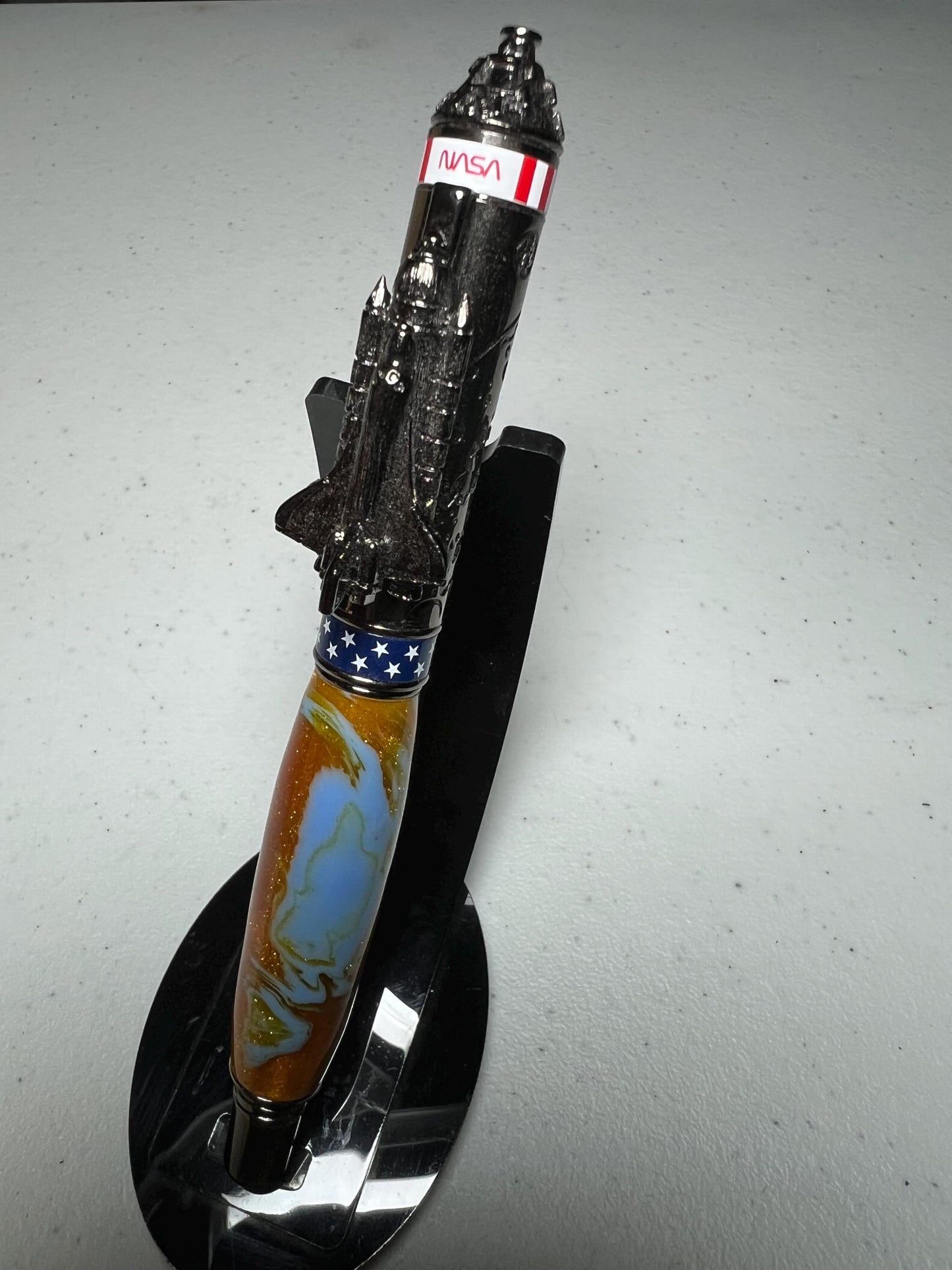 Shuttle two part rollerball pen in gunmetal with blue and gold glitter barrel
