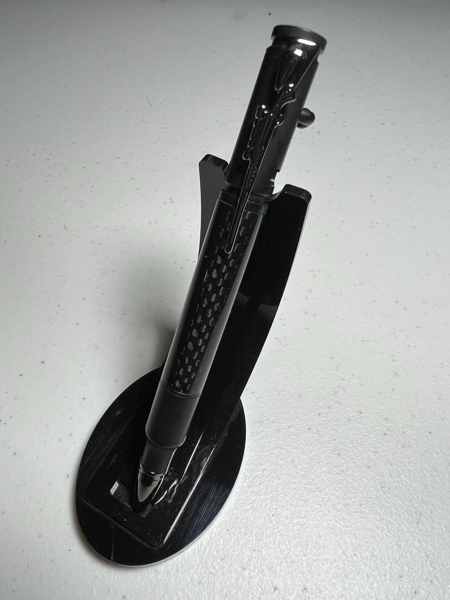 Bolt-action rifle pen black enamel fittings with carbon fiber barrel.
