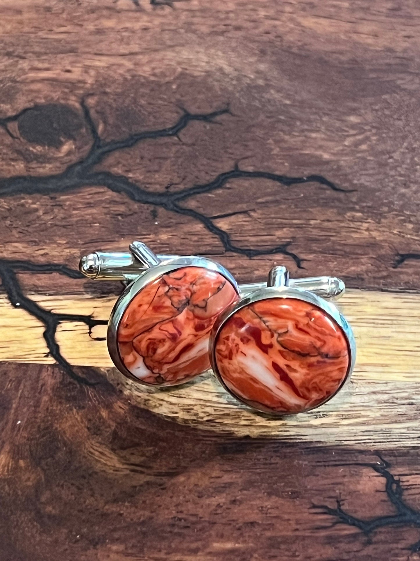 Rhodium cuff links and tie clip with red and white polymer settings