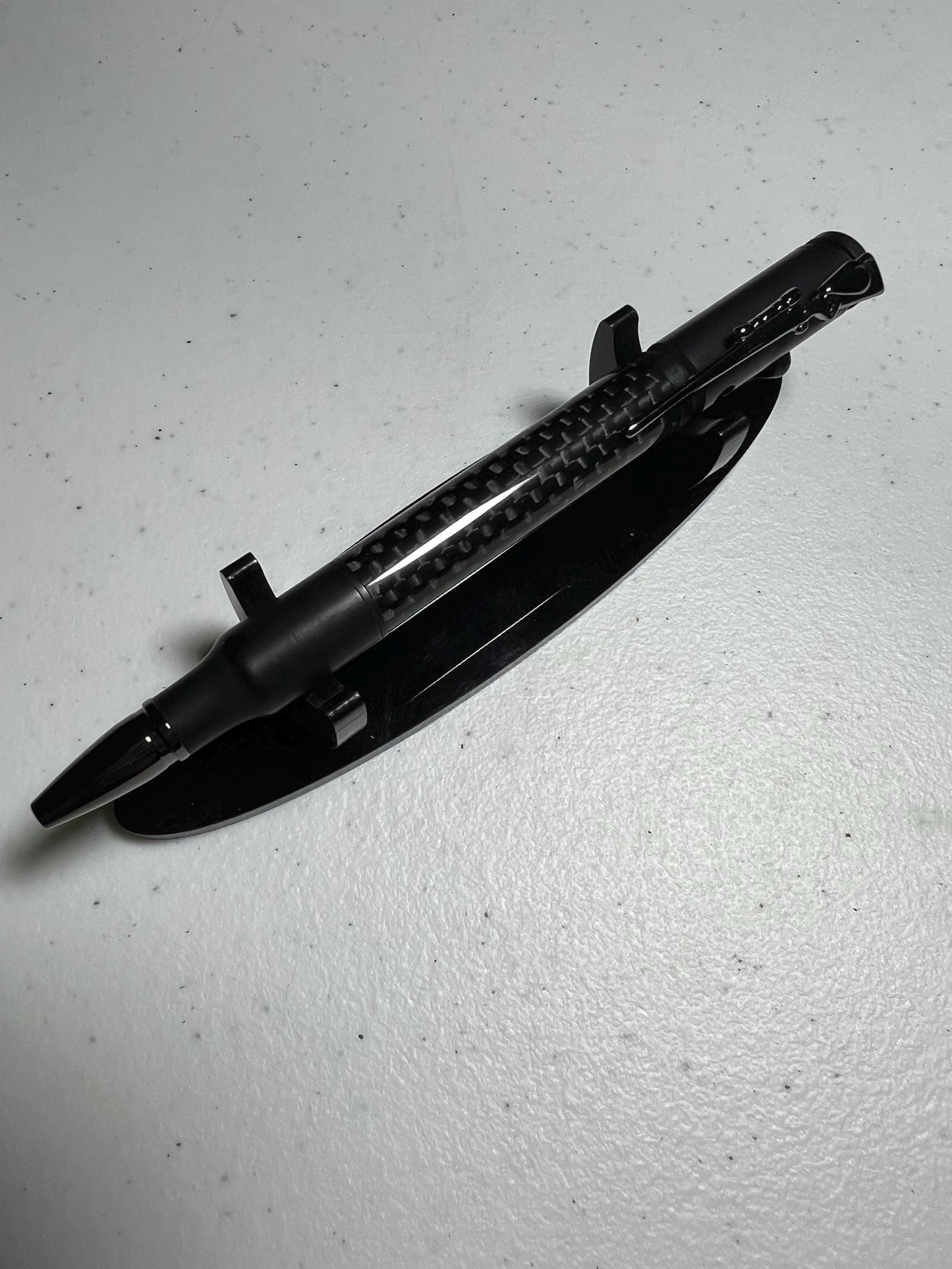 Bolt-action rifle pen black enamel fittings with carbon fiber barrel.