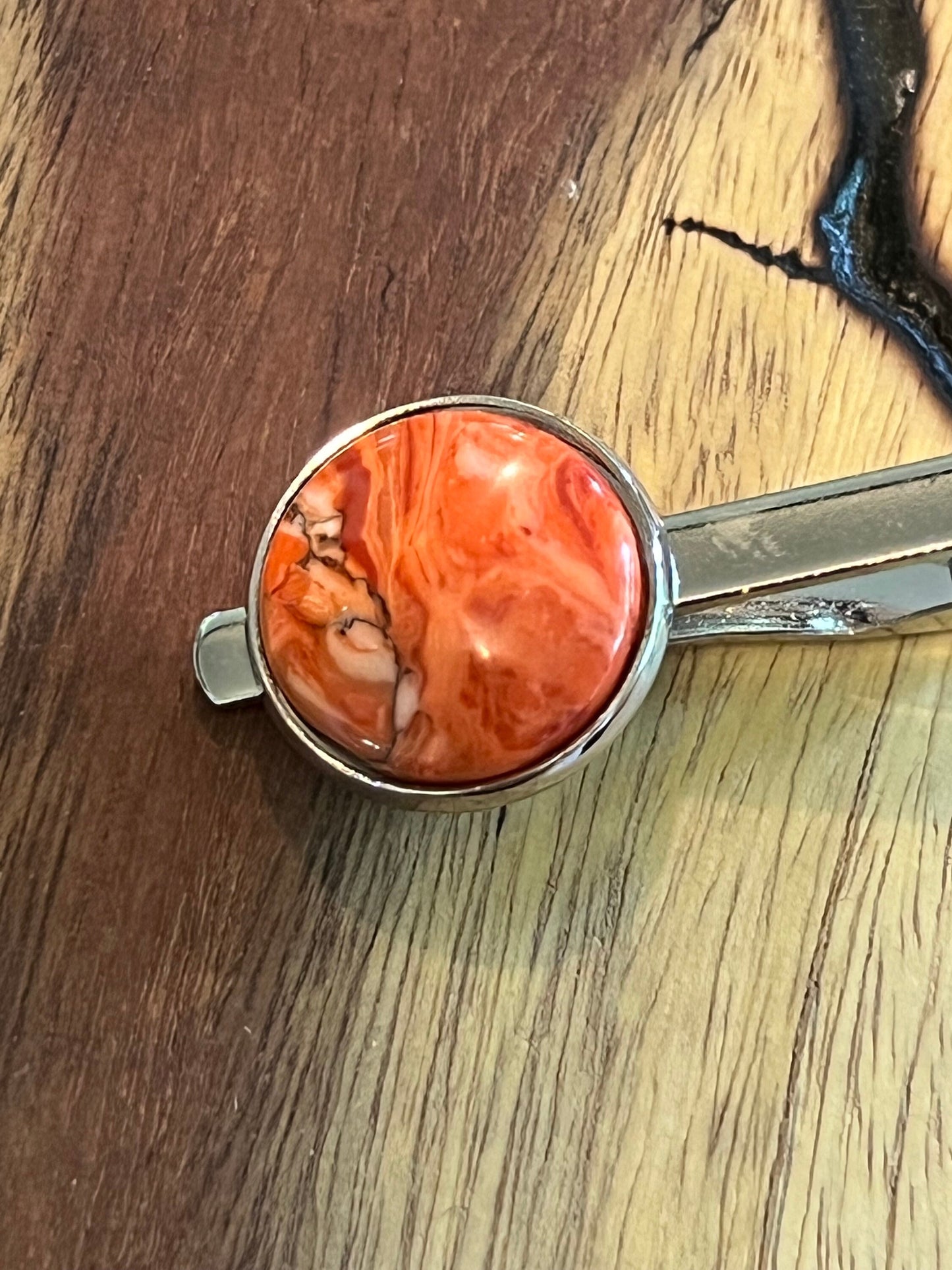 Rhodium cuff links and tie clip with red and white polymer settings