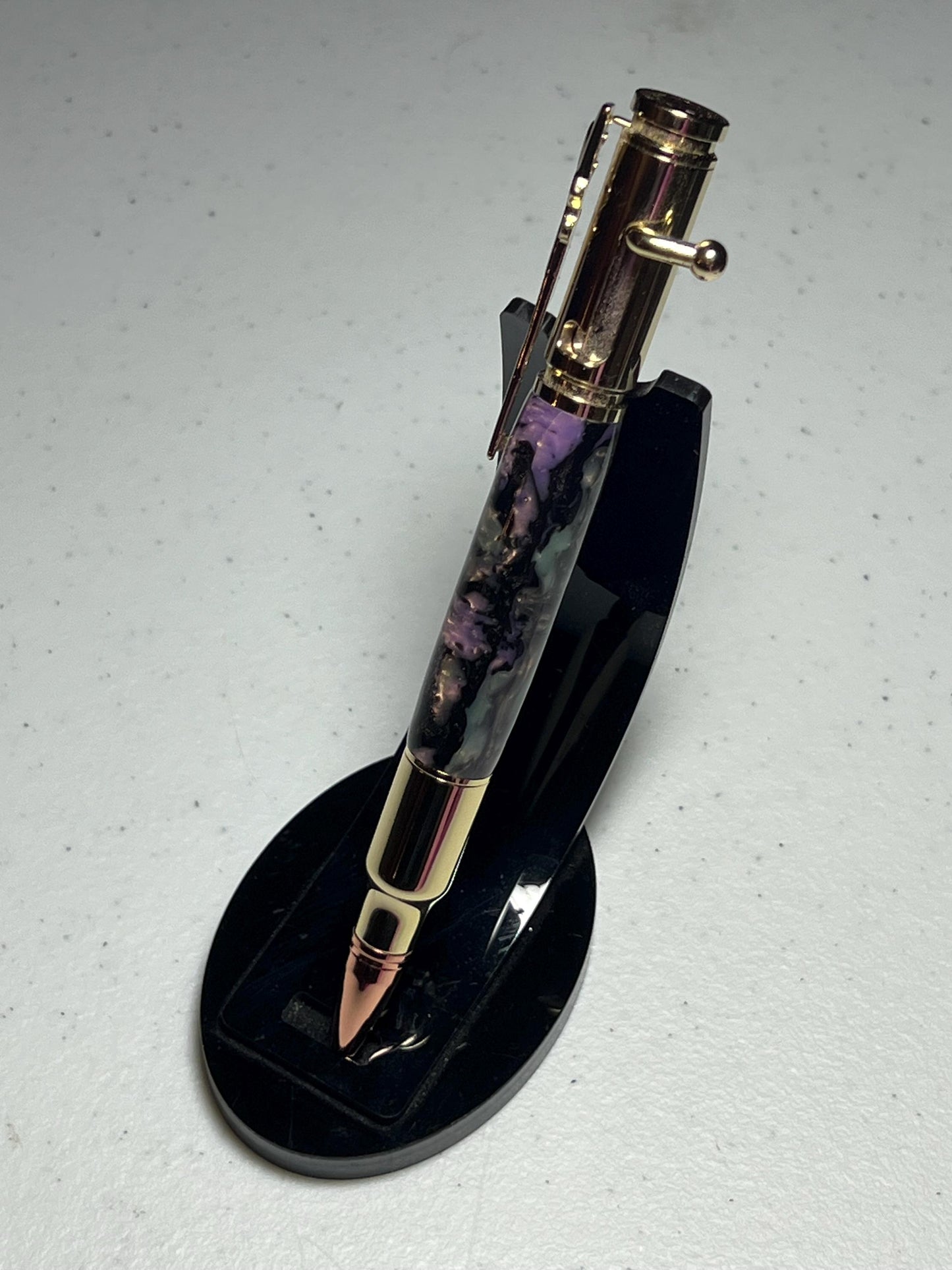 Bolt-action rifle pen gold fittings with mother of pearl barrel.