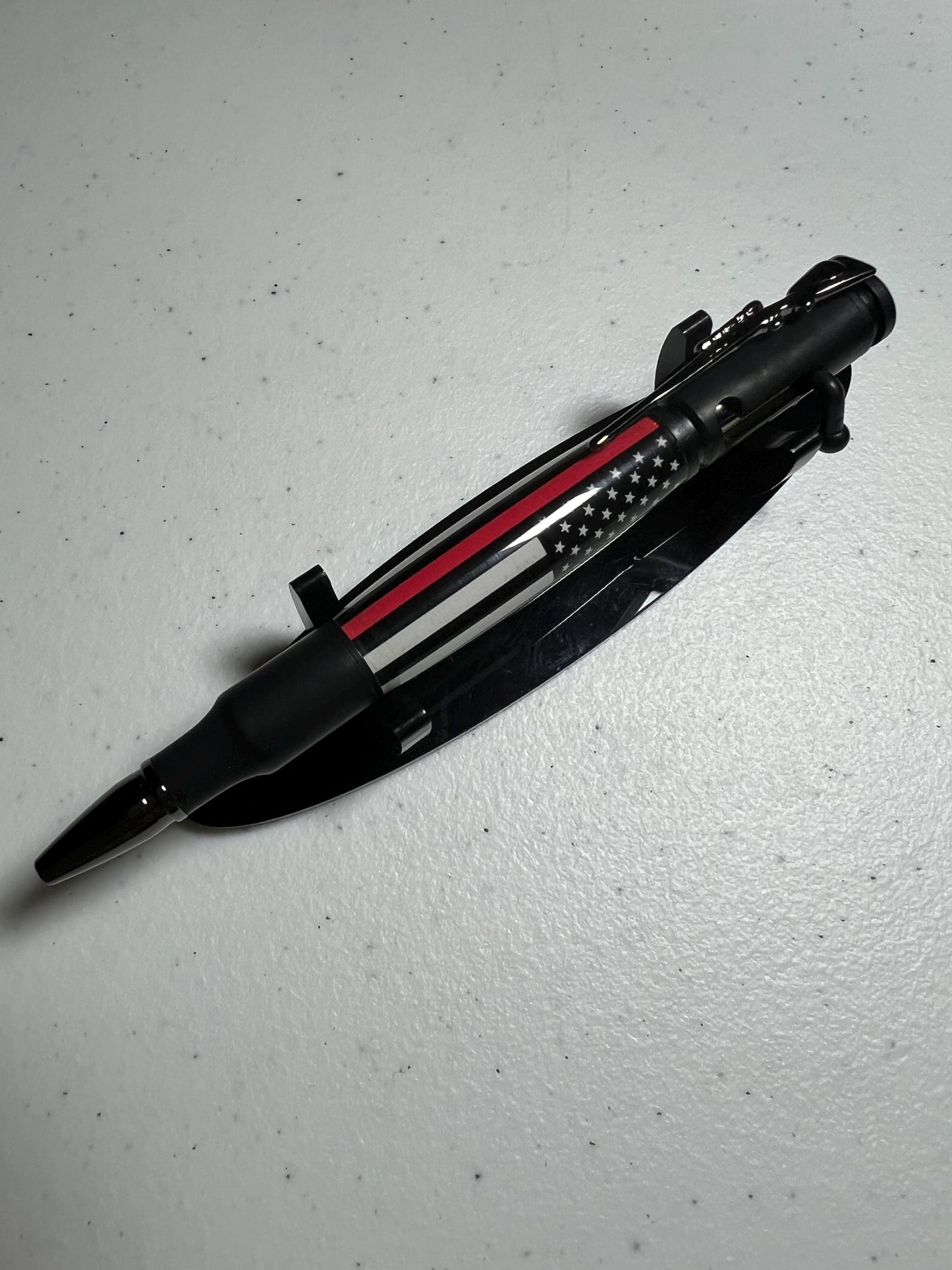 Bolt-action rifle pen black enamel fittings with thin red line barrel.