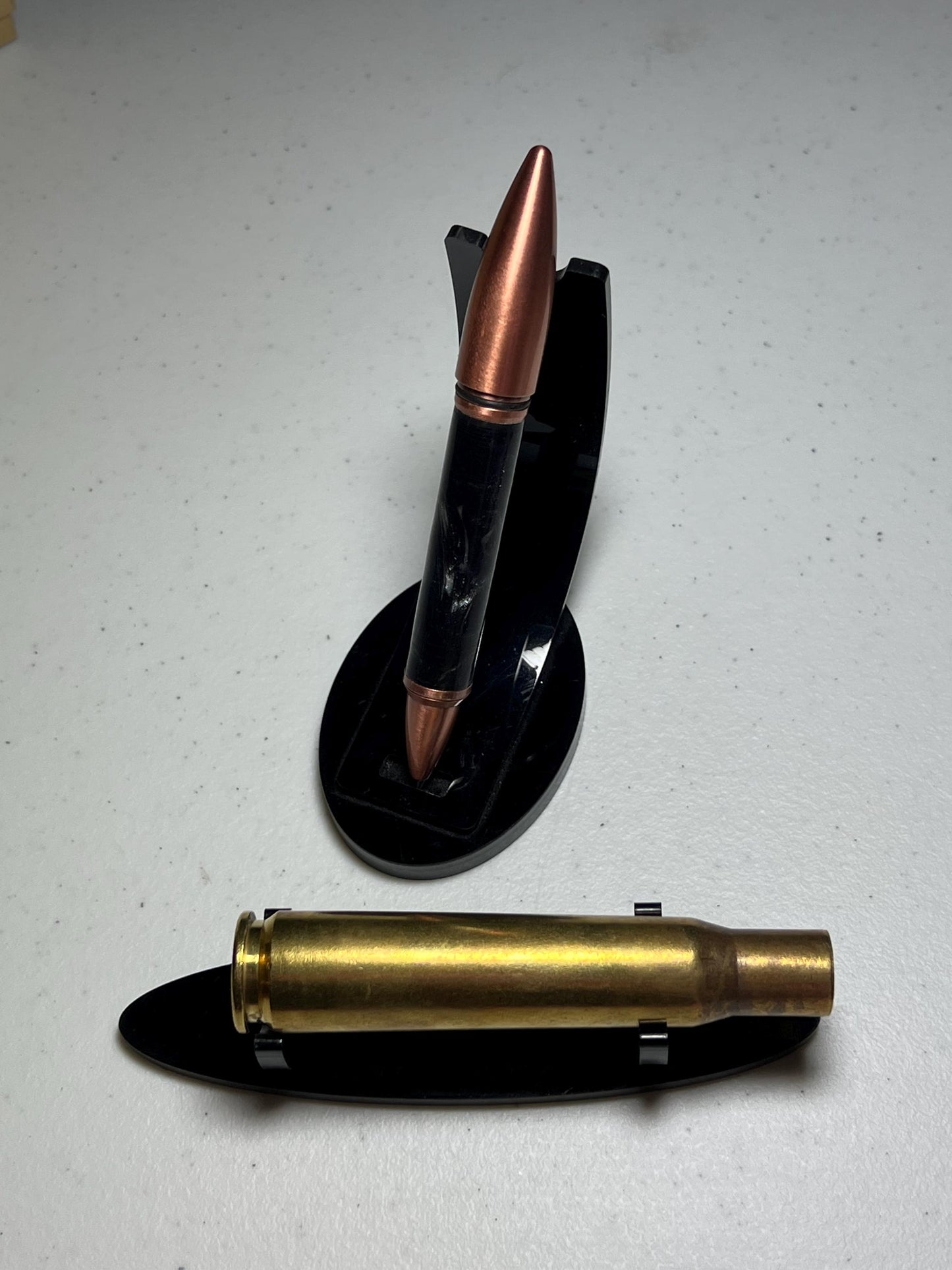 50 caliber bullet flip pen with black cloud barrel