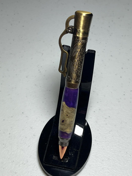 Lever action pen in antique brass with purple resin and burl barrel